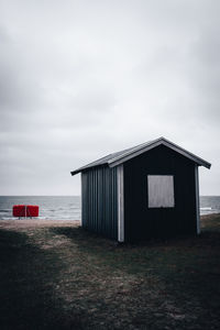 Built structure on beach against sky