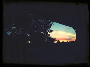 Built structure against sky at sunset