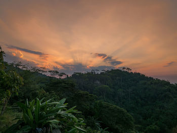 Scenic view of landscape against sky during sunset