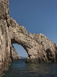 Scenic view of sea against clear blue sky