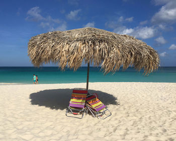 View of beach against cloudy sky