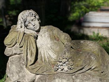 Close-up of angel statue in cemetery