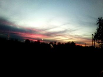 Scenic view of silhouette landscape against sky at sunset