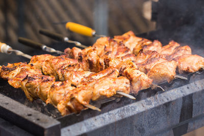 High angle view of meat on barbecue grill