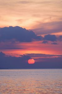 Scenic view of sea against orange sky