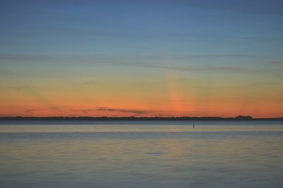 View of sea against cloudy sky during sunset