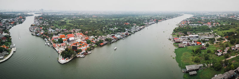 High angle view of river amidst cityscape