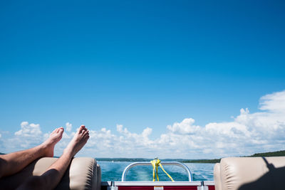 Teenager's feet in the air on a boat in kansas city