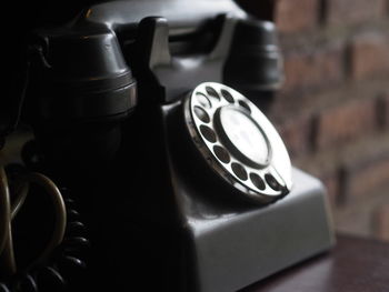 Close-up of retro telephone on table
