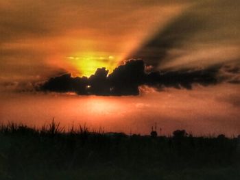 Scenic view of dramatic sky during sunset