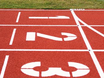 Close-up of numbers on running track