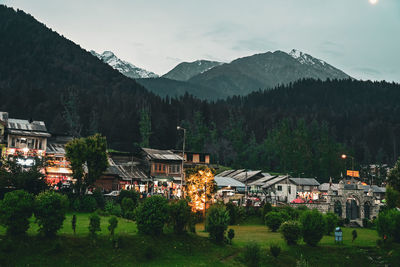 High angle view of townscape and mountains against sky