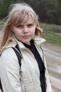 Portrait of teenage girl standing outdoors