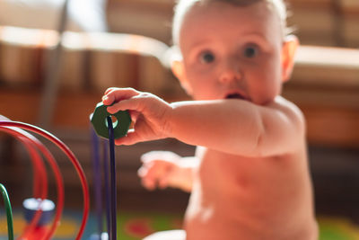 Portrait of cute boy playing with toy