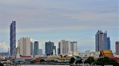 Modern buildings in city against sky