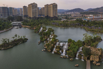 High angle view of river amidst buildings in city