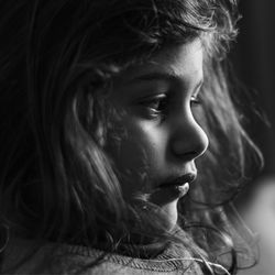 Close-up portrait of girl looking away