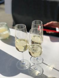 Close-up of wine glasses on table