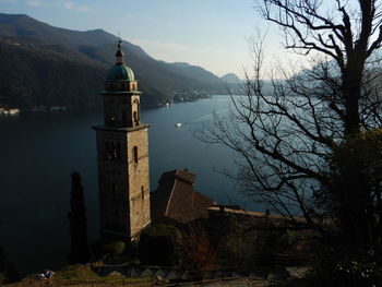 Historic building by mountains against sky