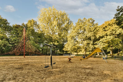 Trees on field against sky