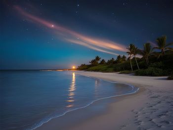 Scenic view of sea against sky at night
