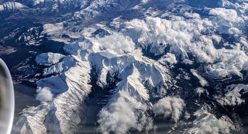 High angle view of snow mountains against sky