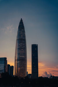 Low angle view of buildings against sky during sunset