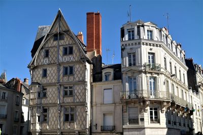 Low angle view of buildings against clear sky