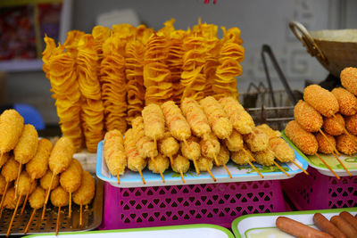 Closeup of fried sweet potato and fried spiral potato in the market