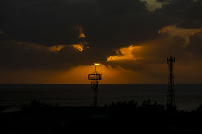 Sunset over the ocean in the village of albion, mauritius.