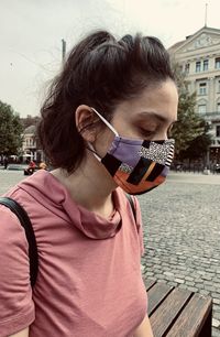 Portrait of man wearing sunglasses standing on street in city
