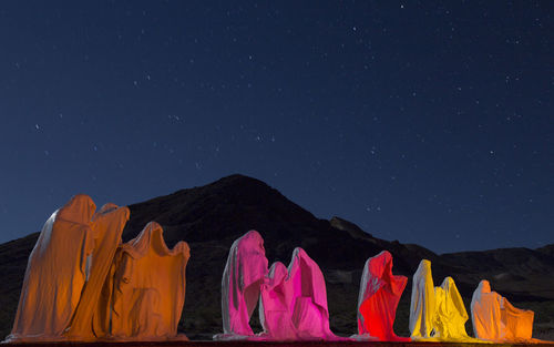 Low angle view of tent against clear sky at night