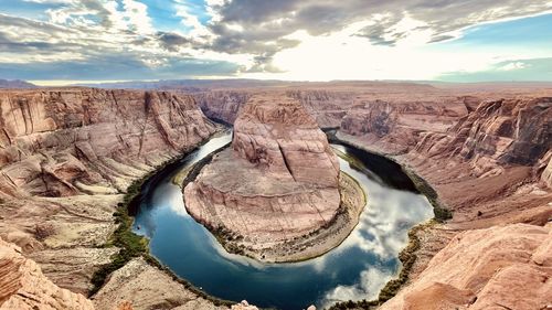 Panoramic view of rock formations against sky
