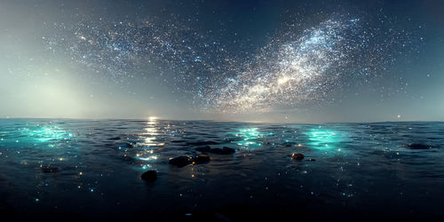 Low angle view of sea against sky at night