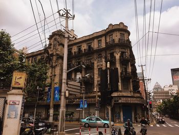 Cars on city against sky