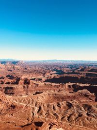 Aerial view of dramatic landscape against clear sky