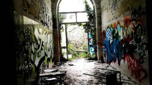 Graffiti on wall in abandoned building