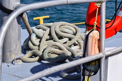 Close-up of rope tied on boat sailing in sea