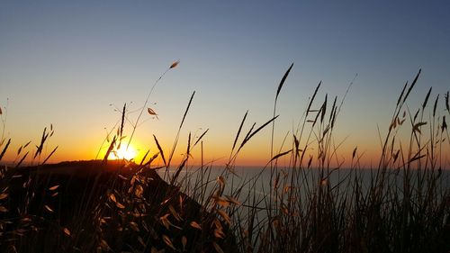 Scenic view of sunset over lake