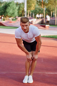 Full length of boy playing tennis