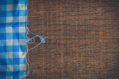 Directly above shot of tablecloth on wooden table