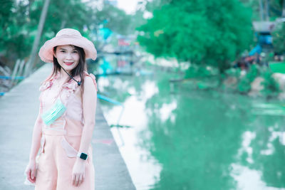 Portrait of beautiful young woman in hat