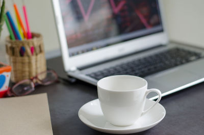 Close-up of coffee cup on table