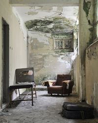 Empty chairs in abandoned building