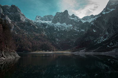 Scenic view of lake and mountains against sky