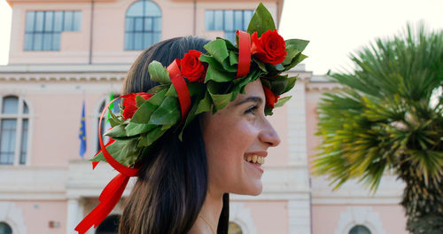 Girl with laurel wreath on her head symbol of graduation in the italian university