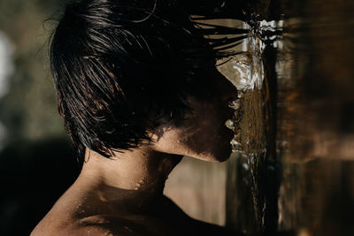 Portrait of shirtless man in water