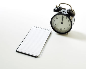 High angle view of clock on table