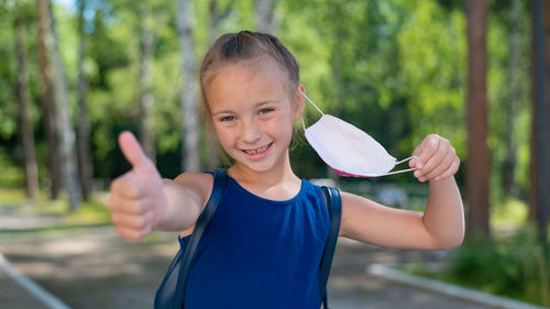 Portrait of girl holding hands