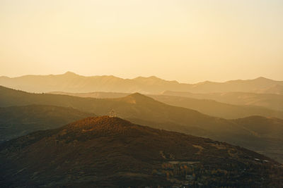 Scenic view of mountains against sky during sunset